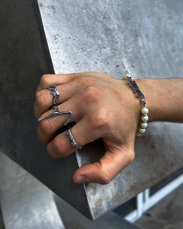 On hand view of our bms spider ring in silver with stainless steel and waterproof function with high quality design and adjustable ring