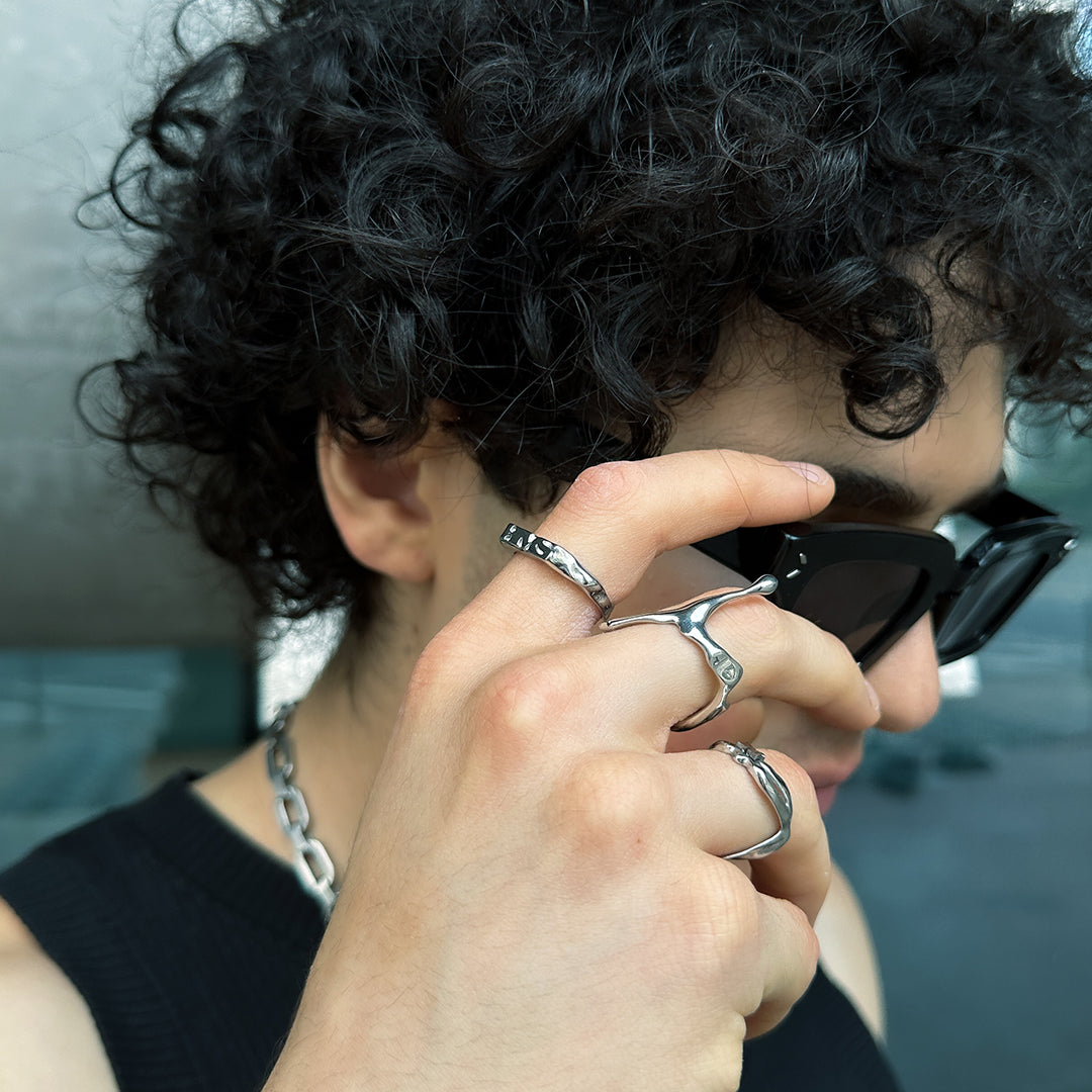 Detail view of our rebirth logo silver ring in silver optic. Stainless steel ring with the bms logo and waterproof