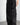 Detail side view of our survivor unisex baggy pants / jeans in black color with silver elements and detachable sidepocket 