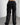 Back detail view of our survivor unisex baggy pants / jeans in black color with silver elements and detachable sidepocket 