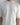 Detail front view of our cropped unisex t-shirt with pattern overlay in color cream. 