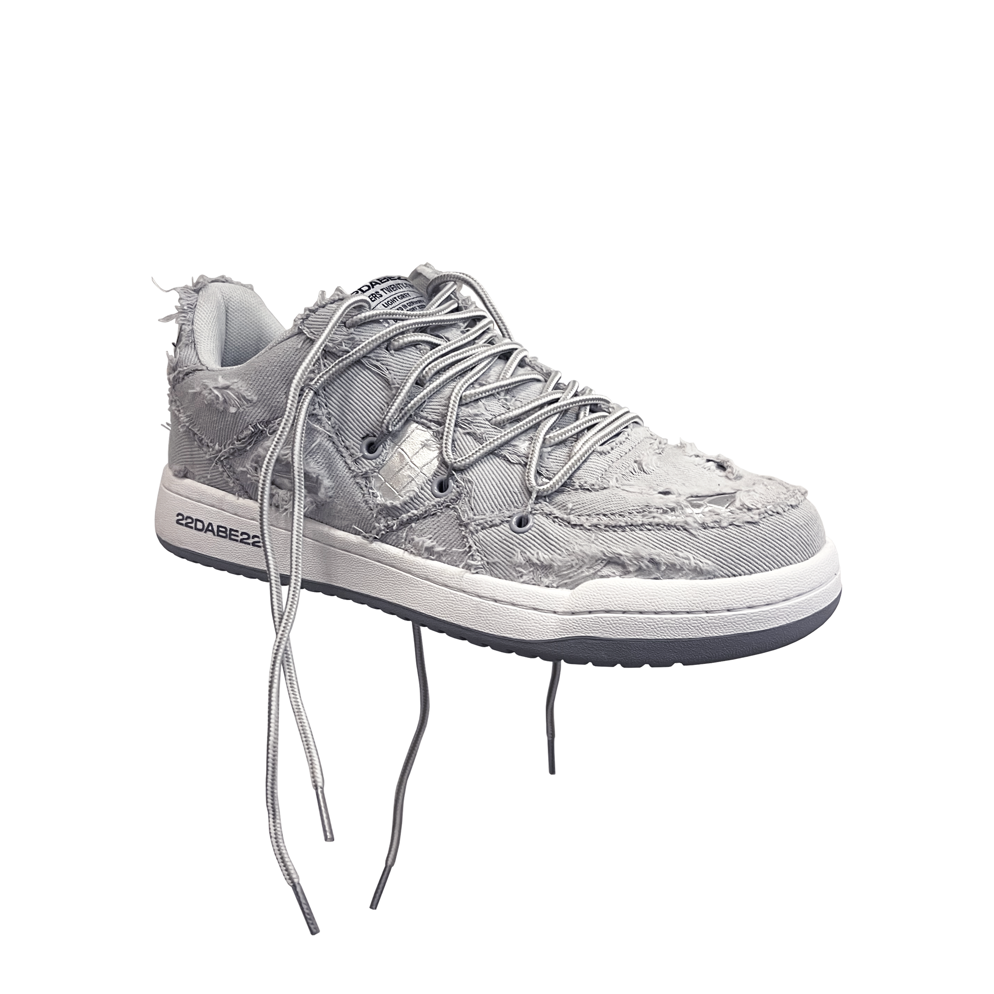 The DABE RANGER TWENTYTWO GREY shoe, a streetwear statement piece with metallic details under denim fabric on the upper. The shoe features double laces for extra style and versatility. Each shoe is handmade and unique, with every hole made by hand, giving it a one-of-a-kind look. The shoe is perfect for those who want to stand out from the crowd and make a fashion statement.